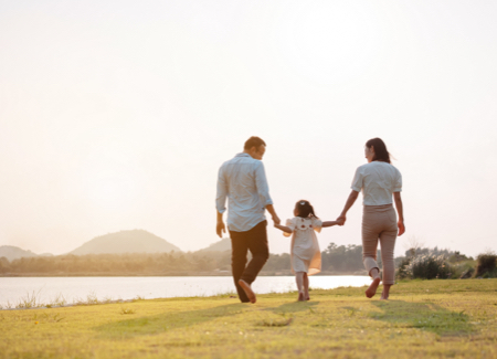 insurance Family walking in a field