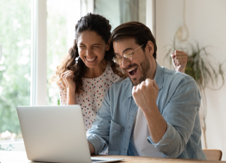 2 people looking at a laptop screen